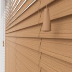 Light brown oak grain wooden blinds close up