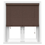 dark brown bamboo wooden blind in a white framed window