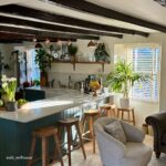 Country cottage house with wooden blinds in the window